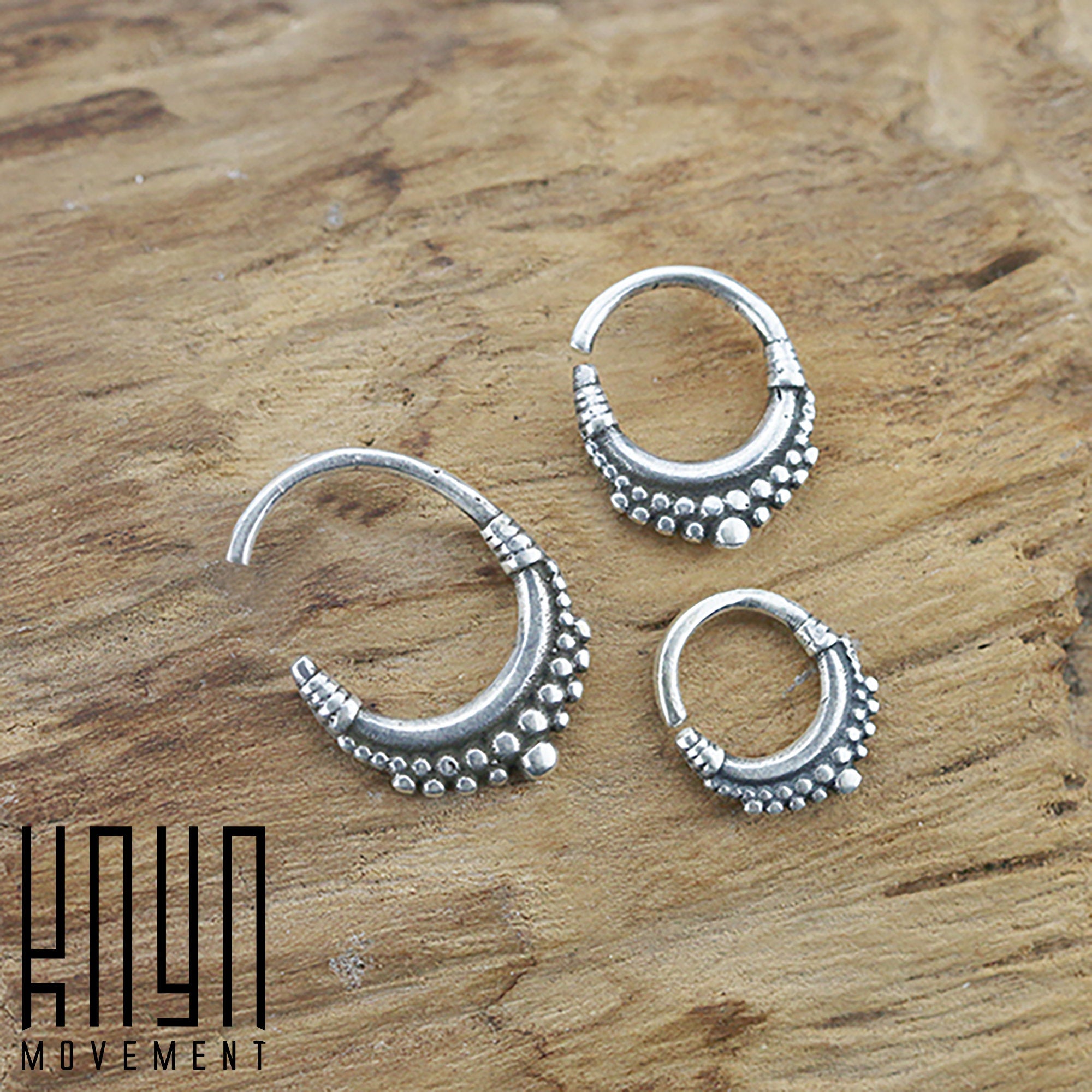 Three BIASA Seamless Rings in Silver (16 gauge) from Kaya Movement, featuring intricate dot detailing and a boho beaded design, are displayed on a wooden surface. The Kaya Movement logo is visible in the bottom left corner of the image.